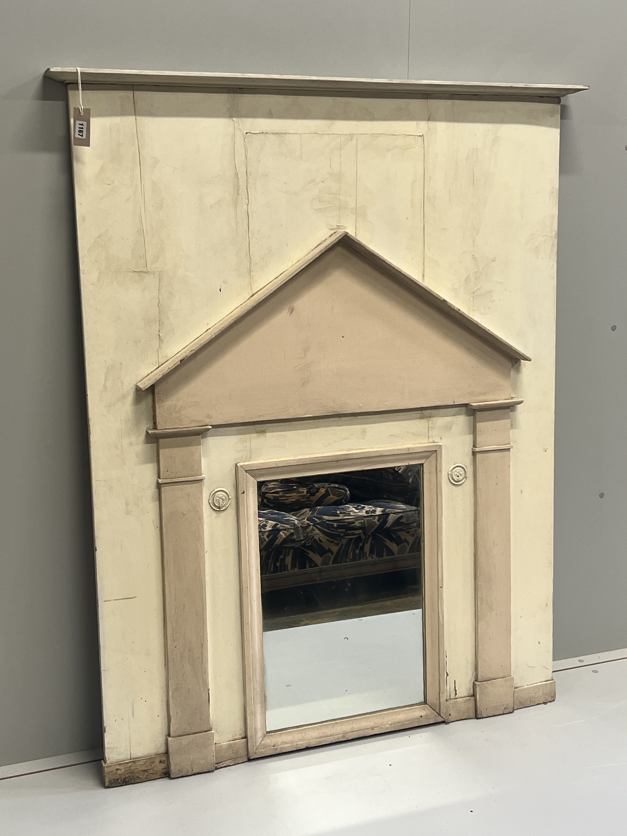 A late 18th/early 19th century French painted pine wall mirror modelled as an arched doorway, width 119cm, height 147cm